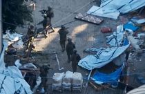 Israeli soldiers walk in the area of Al-Shifa hospital in Gaza City in footage purporting to show two army brigades operating on the ground.