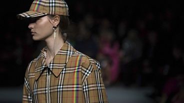 A model wears a creation by designer Burberry at the Autumn/Winter 2018 fashion week runway show in London, in February 2018.