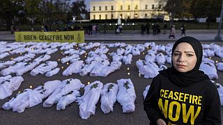 Fake white body bags, representing those killed in the escalating conflict in Gaza and Israel, in front of the White House