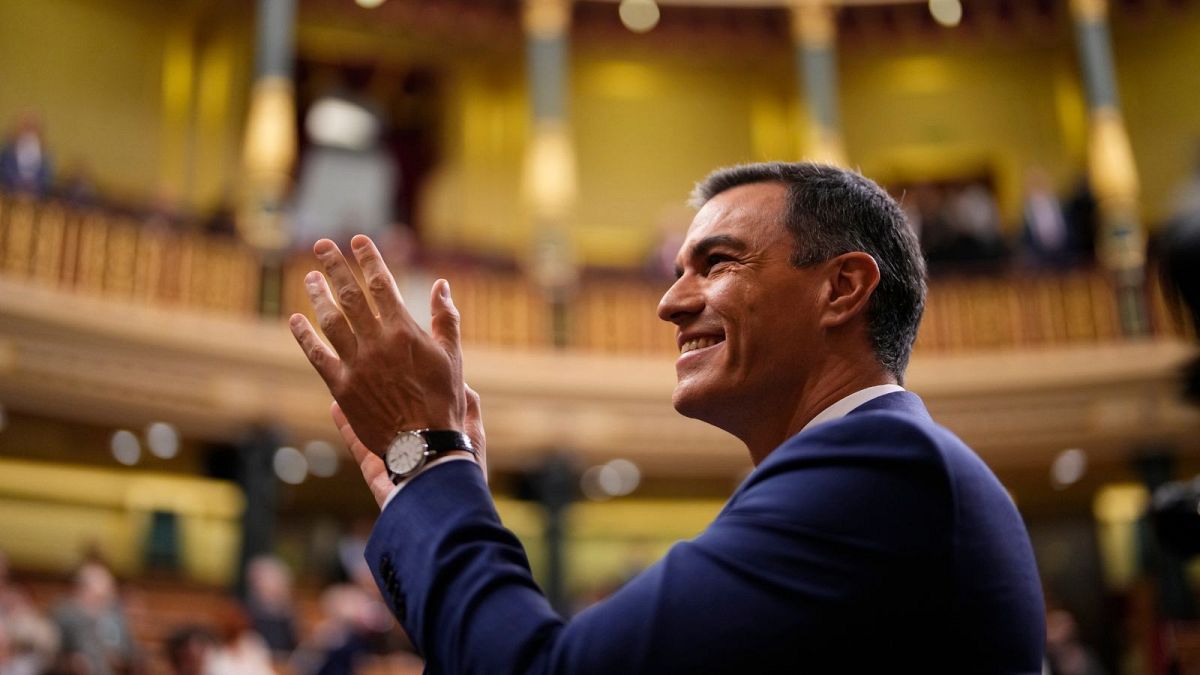 Spain's acting Prime Minister Pedro Sánchez applauds during the investiture debate and vote at the Spanish Parliament in Madrid, Spain, Thursday, Nov. 16, 2023. 