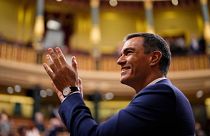 Spain's acting Prime Minister Pedro Sánchez applauds during the investiture debate and vote at the Spanish Parliament in Madrid, Spain, Thursday, Nov. 16, 2023. 