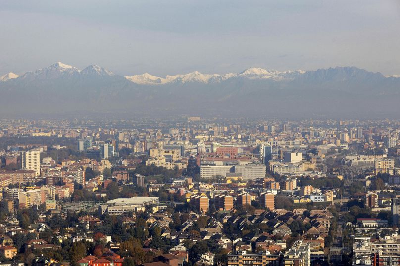 A view of Milan's skyline with the Lombardy pre-Alps, seen in the background.