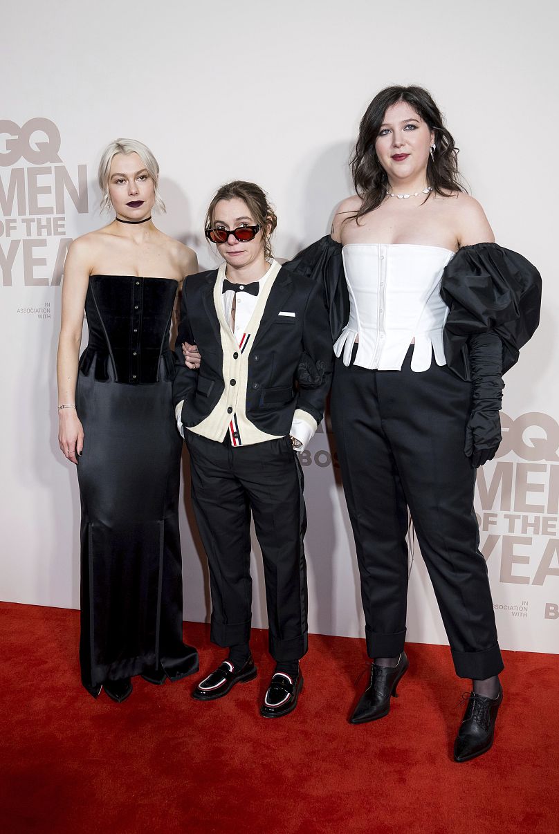 Phoebe Bridgers, from left, Julien Baker and Lucy Dacus of Boy Genius pose for photographers upon arrival at the GQ Men of the Year Awards in London