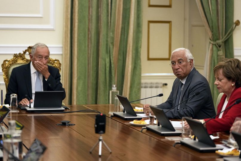 Outgoing Portuguese Prime Minister Antonio Costa, centre, and President Marcelo Rebelo de Sousa, left.