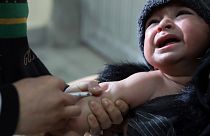 A child receives a measles vaccine at the Indira Gandhi Children Hospital, in Kabul, Afghanistan, Monday, March 15, 2021.