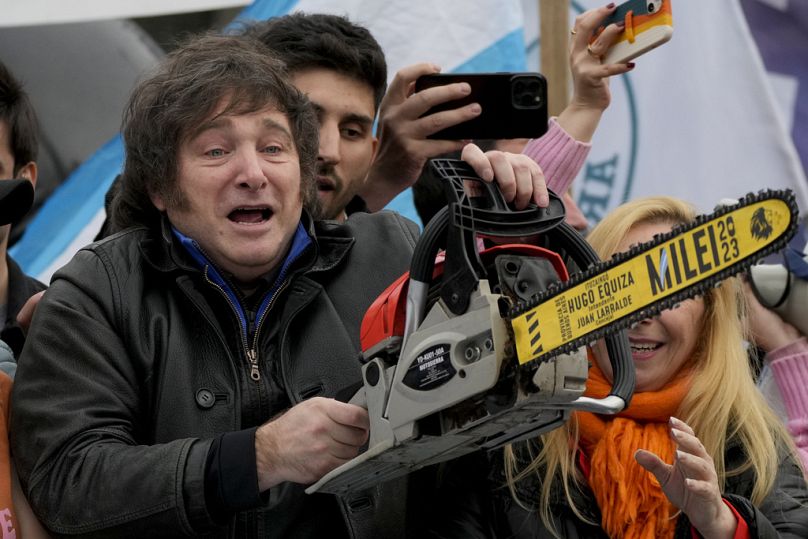 Presidential hopeful of the Liberty Advances coalition Javier Milei brandishes a chainsaw during a campaign event in La Plata, Argentina, Tuesday, Sept. 12, 2023.