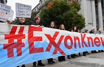 Climate activists protest on the first day of the Exxon Mobil trial outside the New York State Supreme Court building on October 22, 2019 in New York City.