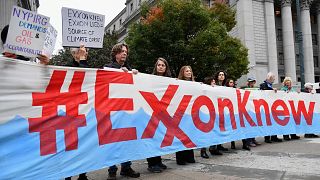 Climate activists protest on the first day of the Exxon Mobil trial outside the New York State Supreme Court building on October 22, 2019 in New York City.