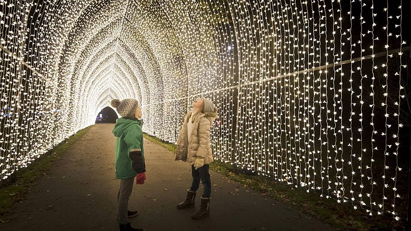 Walk through twinkling light tunnels at Christmas at Kew.