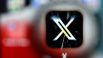 X is displayed on a phone.