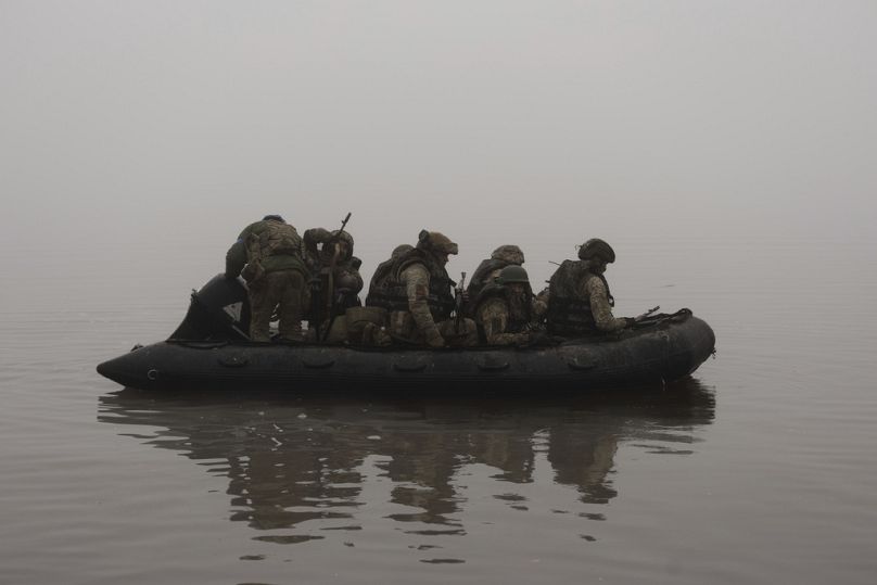 Ukrainian marines sail along the Dnipro river at the frontline near Kherson, Ukraine, Saturday, Oct. 14, 2023