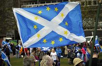 FILE: A combination Saltire and European Union flag flutters after a march in support of Scottish independence through the streets of Glasgow, on May 5, 2018.