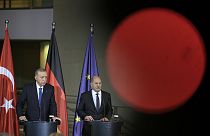 Turkey's President Recep Tayyip Erdogan, left, and German Chancellor Olaf Scholz talk to the media at a press conference at the chancellery in Berlin, Germany, Nov. 17, 2023