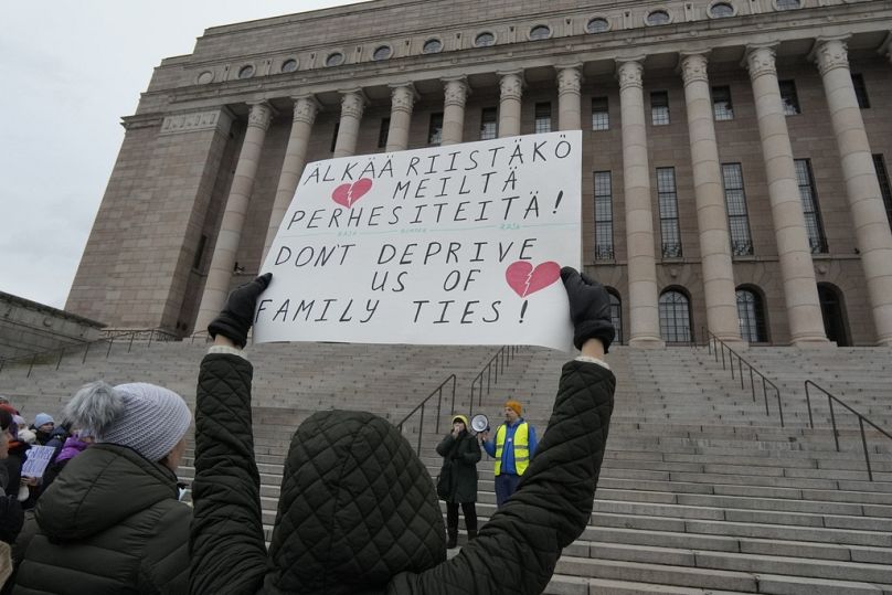 People, most of them ethnic Russians, gather in front of the Finnish parliament to protest against closure of border crossing points with Russia, in Helsinki, Nov. 18, 2023
