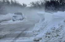 A car is left on the road near the town of Dobrich, Bulgaria, Sunday, Nov. 19 2023. (Bulgarian News Agency via AP)