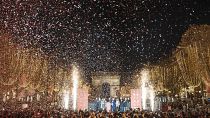 French actor Gilles Lellouche, center right, Paris mayor Anne Hidalgo, center left, and guests during the inauguration of the Champs Elysee Avenue illumination. French actor Gilles Lellouche, center right, Paris mayor Anne Hidalgo, center left, and guests during the inauguration of the Champs Elysee Avenue illumination.