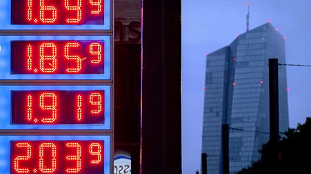 Gas prices are displayed at a gas station next to the headquarters of the European Central Bank, rear, in Frankfurt, Germany, on July 28, 2023.