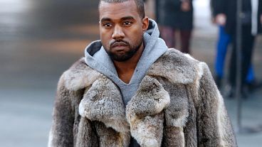 File: Kanye West arrives at Givenchy's men's winter fashion show in Paris, January 2014