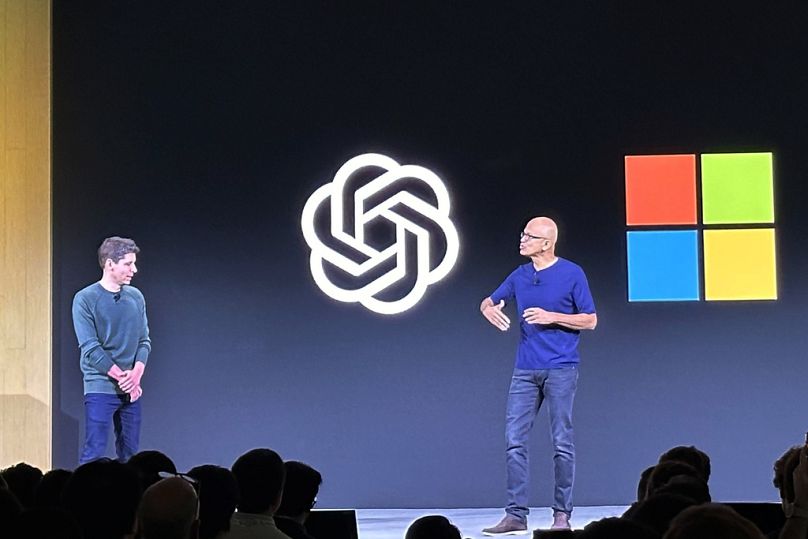 Sam Altman, left, CEO of OpenAI, appears onstage with Microsoft CEO Satya Nadella at OpenAI DevDay, OpenAI's first developer conference, on Monday, Nov. 6, 2023