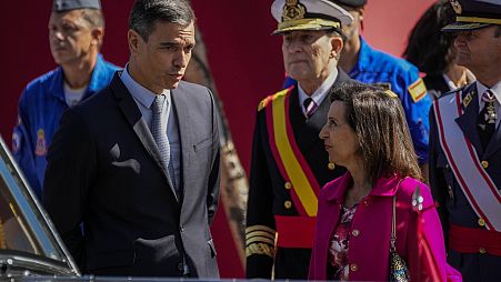 Spain's Prime Minister Pedro Sanchez, left, talks with Spain's Defense Minister Margarita Robles.