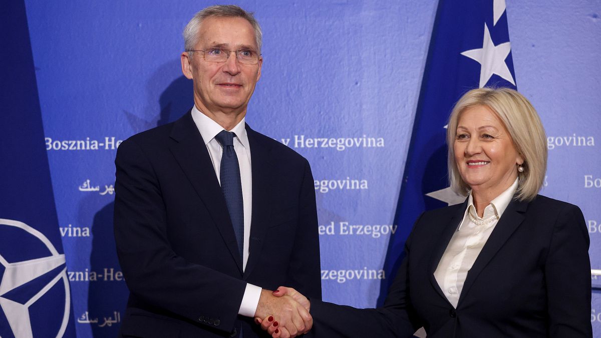 NATO Secretary General Jens Stoltenberg shakes hands with the President of the Council of Ministers of Bosnia and Herzegovina Borjana Kristo 