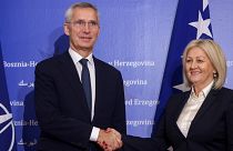 NATO Secretary General Jens Stoltenberg shakes hands with the President of the Council of Ministers of Bosnia and Herzegovina Borjana Kristo 