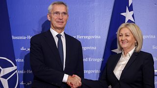NATO Secretary General Jens Stoltenberg shakes hands with the President of the Council of Ministers of Bosnia and Herzegovina Borjana Kristo 
