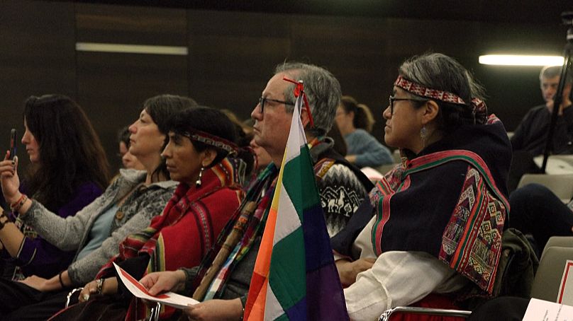 Mid shot Bolivian audience members during the ceremony, 20 November 2023.