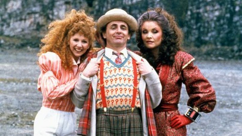 Sylvester McCoy with companions