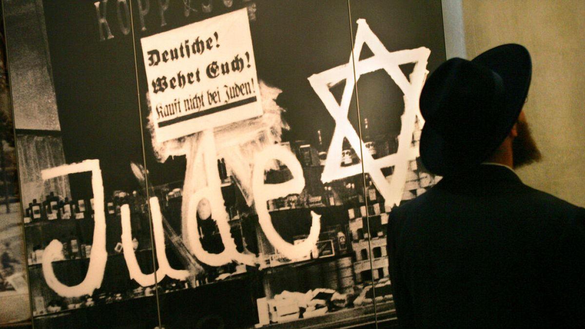 FILE - An Israeli man looks at a display at the Yad Vashem Holocaust Memorial in Jerusalem, Tuesday, April 25, 2006.