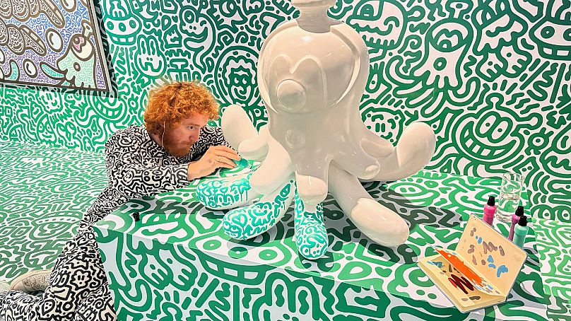 Mr. Doodle working on a sculpture named "Jellyboggle" at Pearl Lam Galleries in Hong Kong.