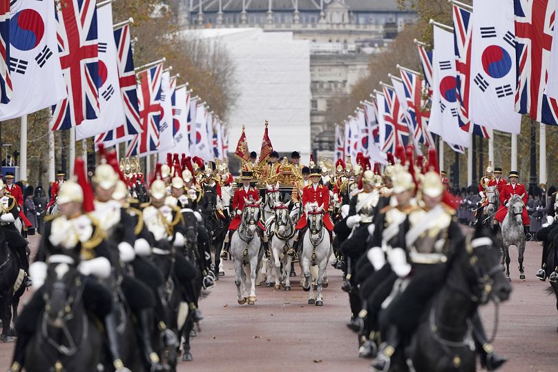 British and South Korean flags line The Mall during a military procession for the welcome ceremony for South Korea's President
