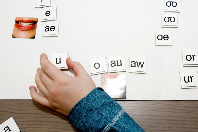 A child works on recognizing vowel sounds during a session in Omaha, January 2017