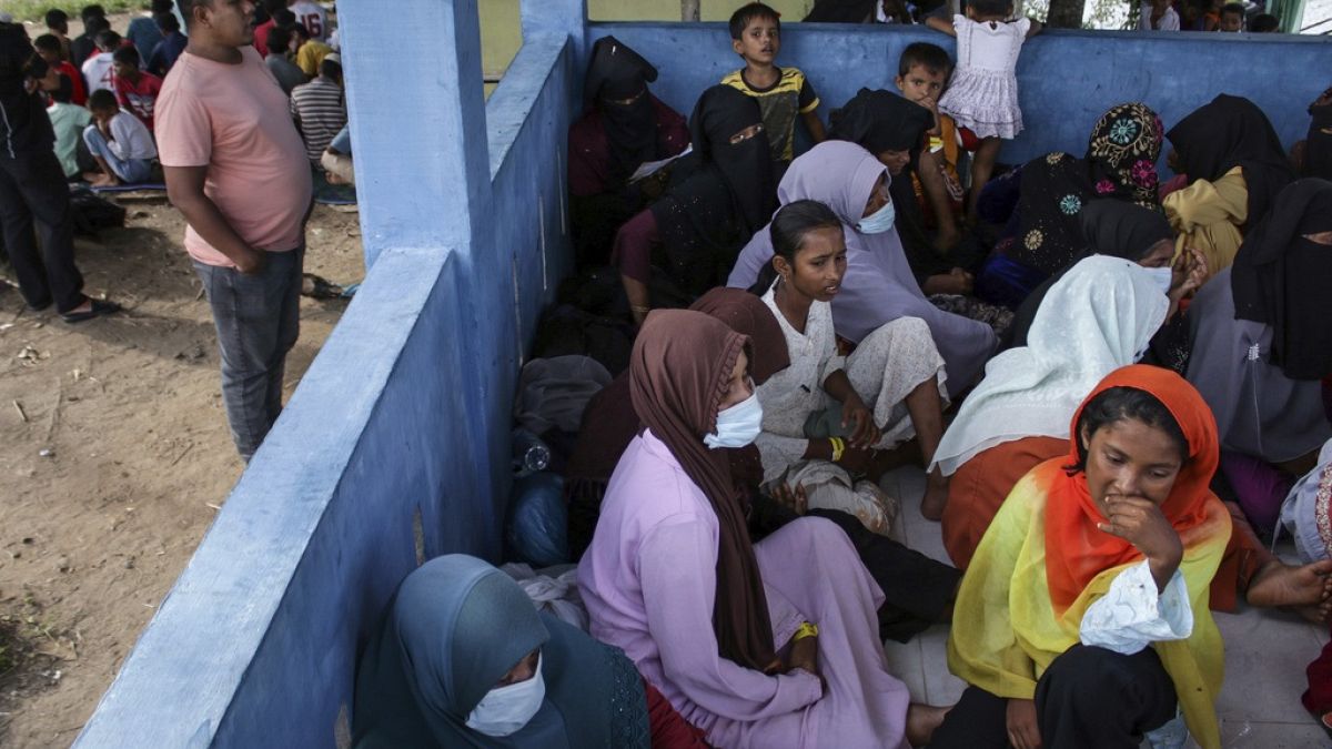 Newly-arrived ethnic Rohingya women, part of a group who was denied landing a few times by local residents, rest at a temporary shelter in Bireun, Aceh province.
