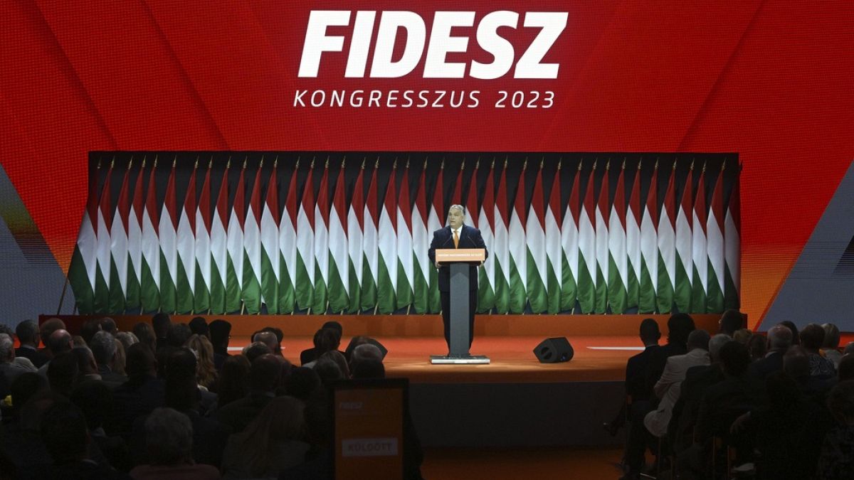 Hungarian Prime Minister Viktor Orban, center, delivers his speech after he was re-elected at the election of officials congress of the ruling Hungarian Fidesz.