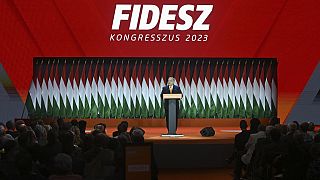 Hungarian Prime Minister Viktor Orban, center, delivers his speech after he was re-elected at the election of officials congress of the ruling Hungarian Fidesz.