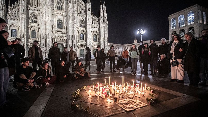 People attend a candlelight vigil in front of the Milan Duomo Cathedral for 22-year-old Giulia Cecchettin, northern Italy, Sunday, Nov. 19, 2023.