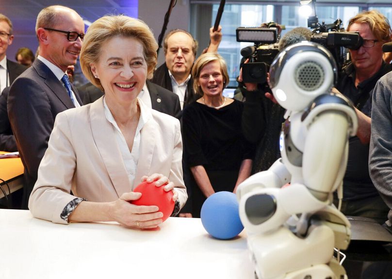 President of the European Commission Ursula von der Leyen looks at the invention 'Do you Speak Robot?' at the AI Xperience Center at the VUB in Brussels, February 2020
