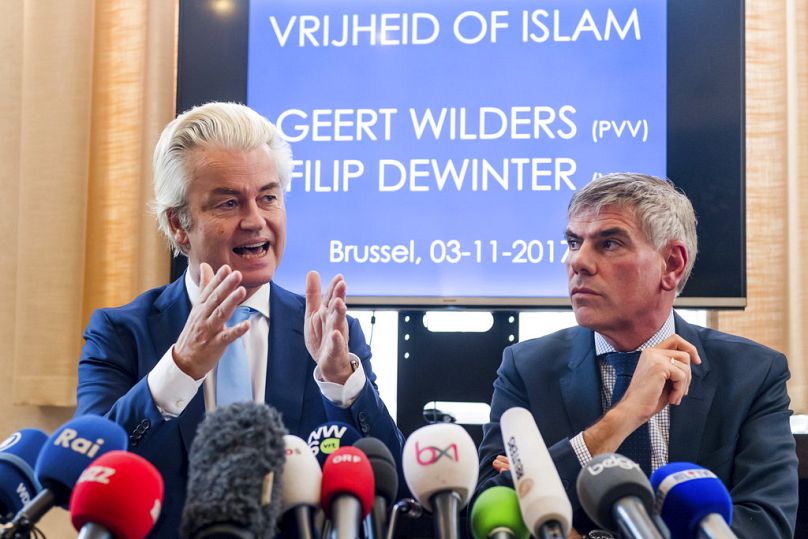 FILE: Dutch far-right leader Geert Wilders, left, and Belgian anti-immigrant politician Filip Dewinter talking at Dutch Parliament, November 2017