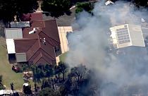 Bush fires destroy homes in northern Perth. 