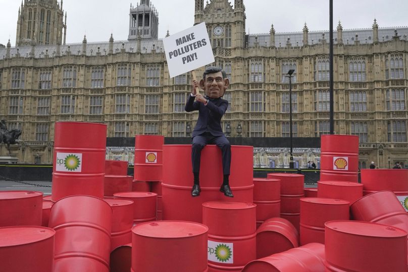 Oxfam's Rishi Sunak 'big head' protests outside the Parliament in London, September 2023