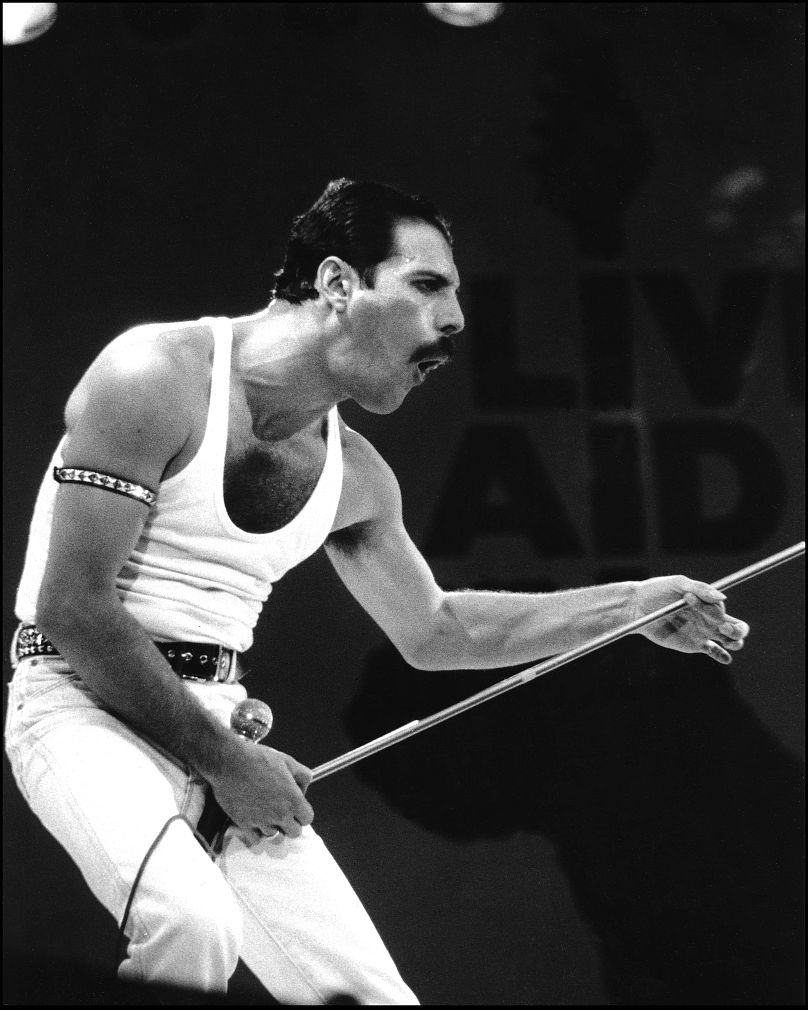 Freddy Mercury with Queen on stage at Live Aid on 13 July 1985 at Wembley Stadium, London.