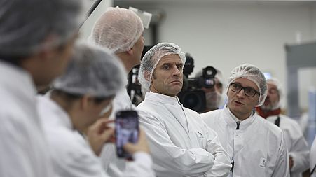 French President Emmanuel Macron visits the plant of Danish pharmaceutical company Novo Nordisk in Chartres, south west of Paris, Thursday, Nov. 23, 2023.