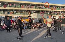 Acrobats entertain children at a school for displaced children in Rafah