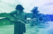 A woman stands near her home in Beni, eastern Congo, March 2021