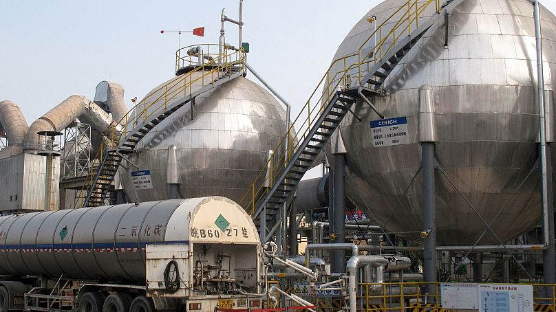Carbon dioxide storage tanks are seen at a cement plant and carbon capture facility in Wuhu, Anhui province, China, September 2019.