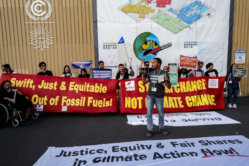 Activists chant slogans during a demonstration calling for "climate justice" and a transition away from fossil fuels at the COP27 climate conference in Egypt's Red Sea resort.