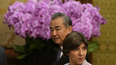French Foreign Minister Catherine Colonna, foreground, walks next to Chinese Foreign Minister Wang Yi in Beijing, November 24th 2023