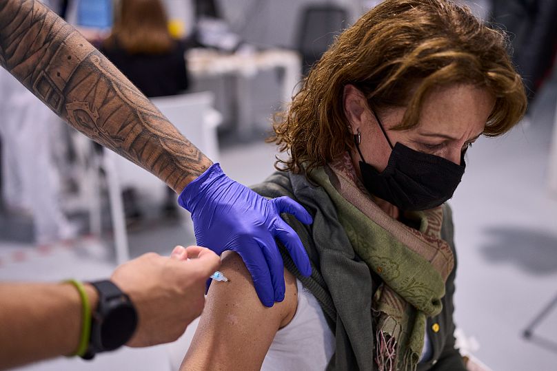 A woman receives the Moderna COVID-19 vaccine in Madrid, Spain, 2021.