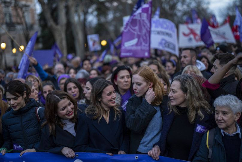 Spain's Equality Minister Irene Montero, center, attends a demonstration during the International Women's Day in Madrid, Wednesday, March 8, 2023.
